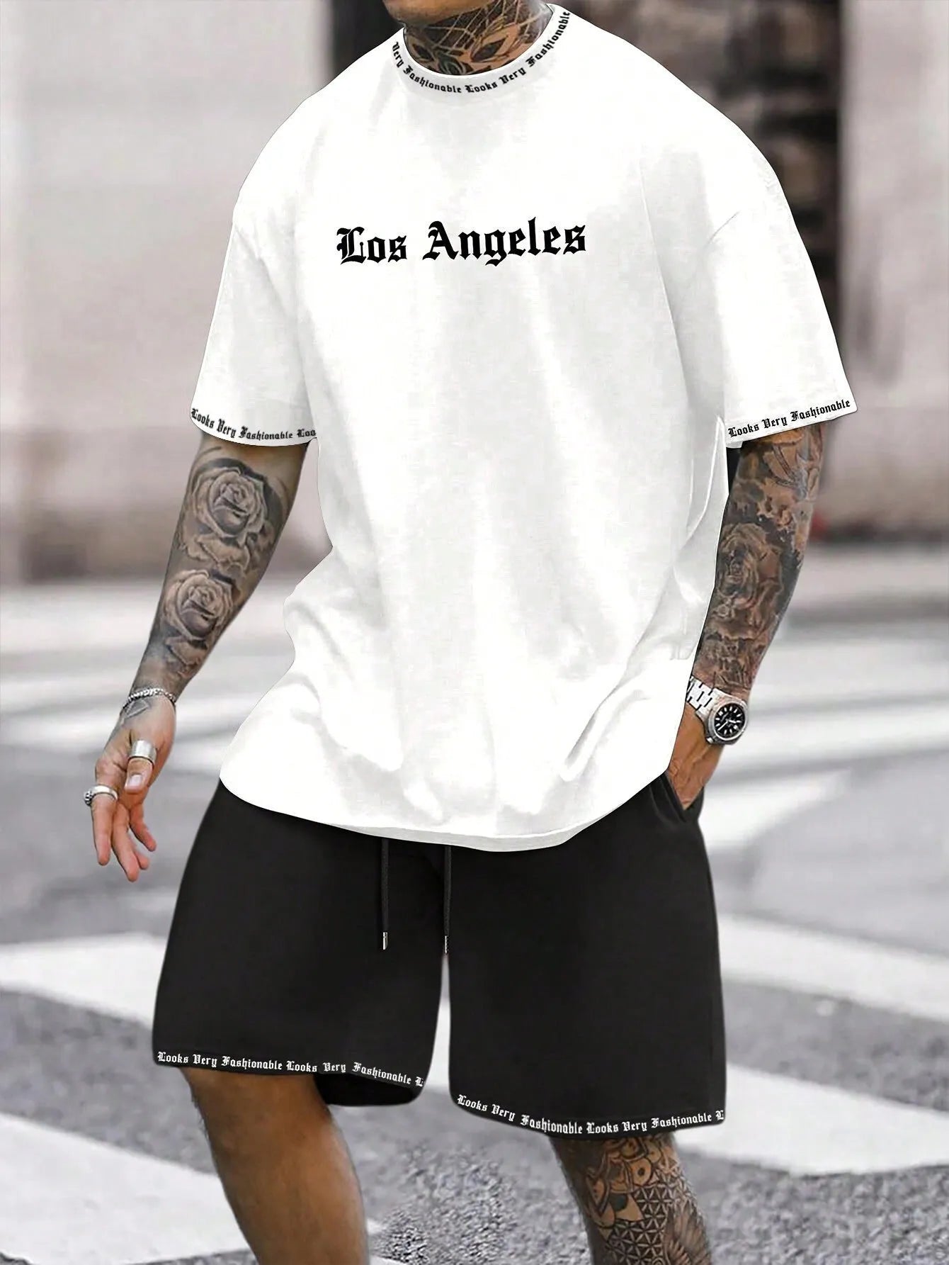 Men's blue sports style short-sleeved top and matching shorts laid flat