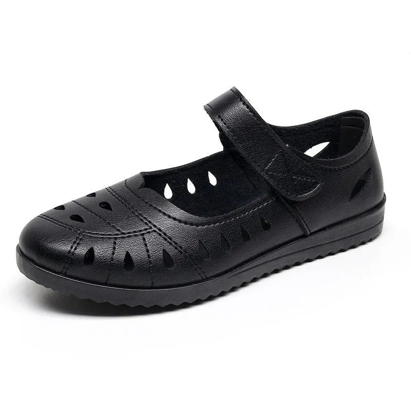 Women's hollow flat sandals in black with Velcro strap and imitation leather upper