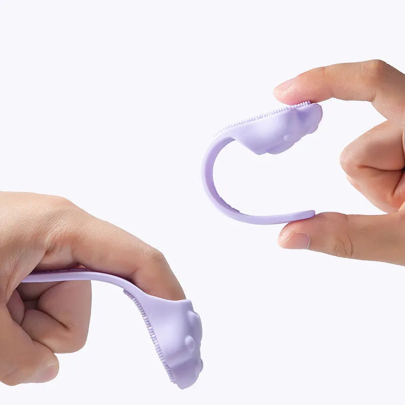 Silicone finger toothbrush for pets in pink, purple, and yellow colours