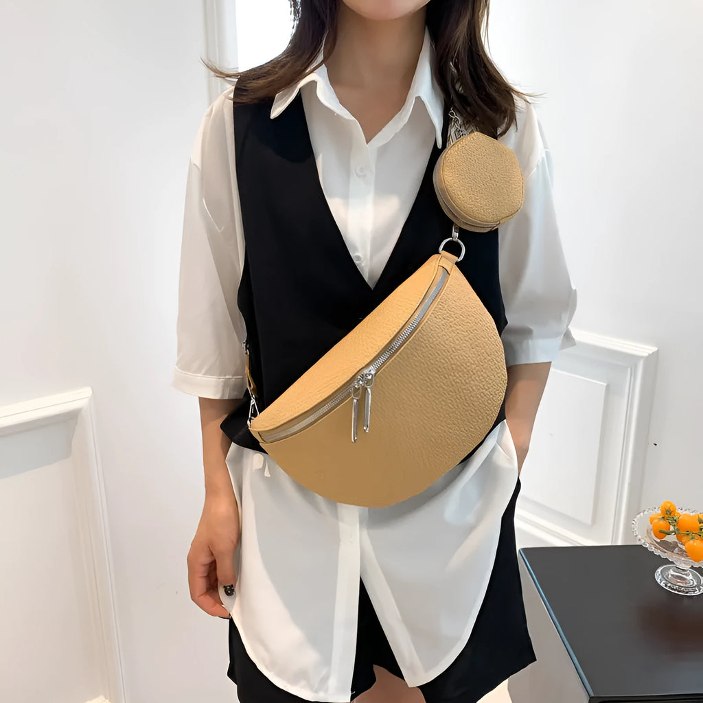 Women's PU leather crossbody bag with clamshell opening in solid colour with zipper texture details