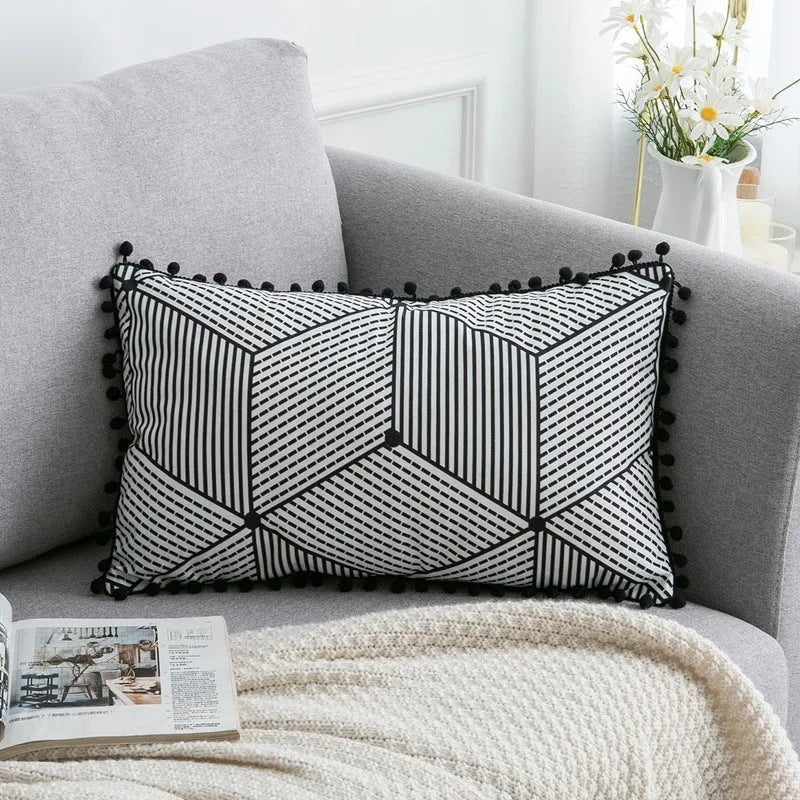 Bohemian national style polyester cushion cover in light grey on a sofa.