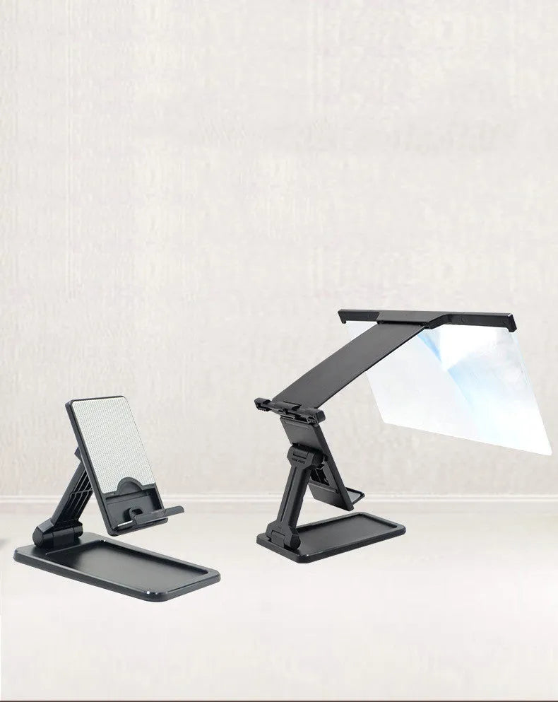 Black foldable mobile phone screen magnifier with detachable shading holder on a desktop.