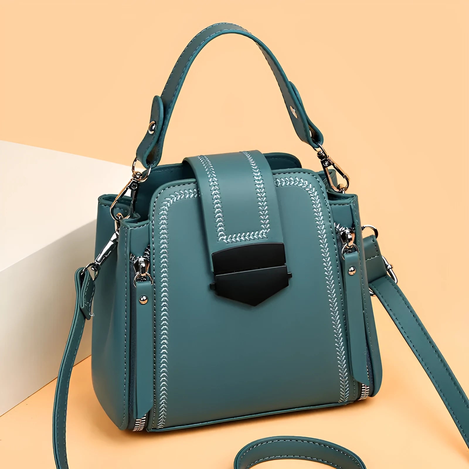 Soft textured PU leather small square handbag for women in multiple colour options showing sewing thread detail.