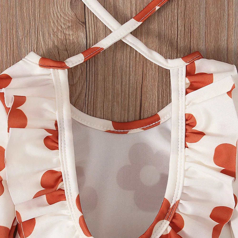 Girl's white floral print one-piece swimsuit with crew neck and open back design