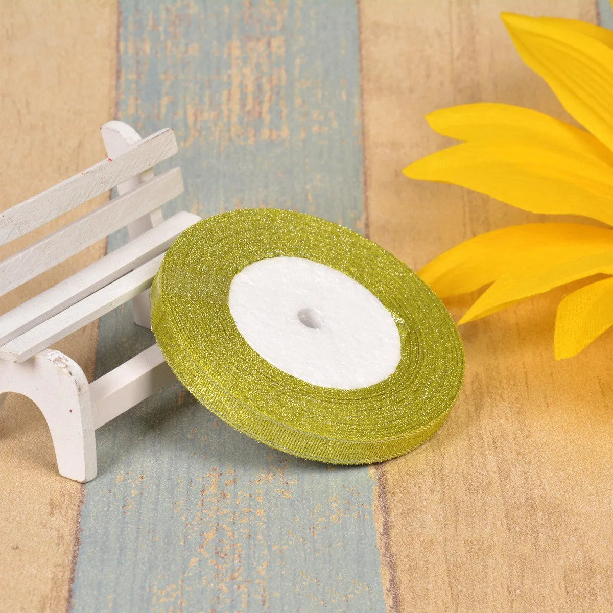Colourful green onion pattern polyester ribbon spool with metallic gold or silver wire detailing.