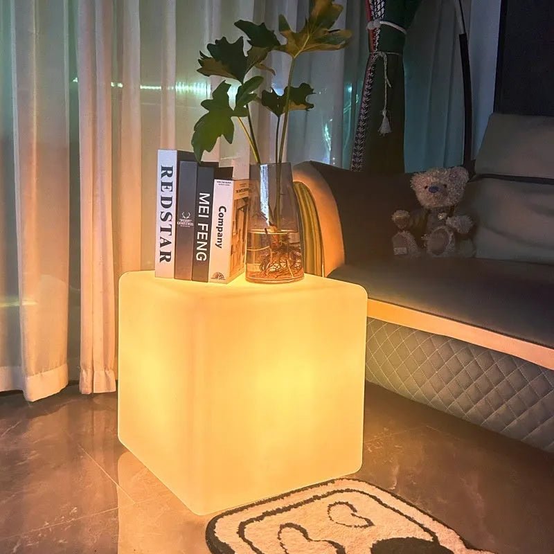 A modern square LED cube light stool for outdoor gardens, available in multiple sizes.
