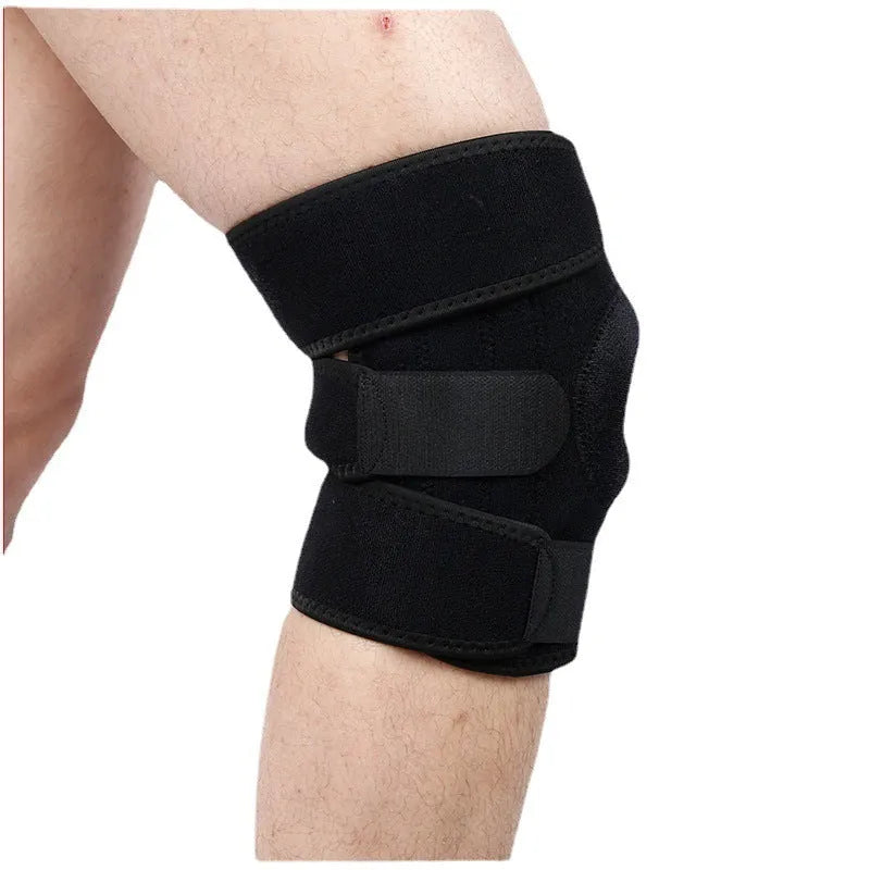 Close-up view of a grey nylon spring support knee pad on a person's knee, showing the fabric texture and strap.
