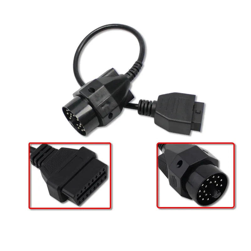 BMW 20-pin male to standard 16-pin OBD2 female diagnostic adapter cable on a workshop bench.