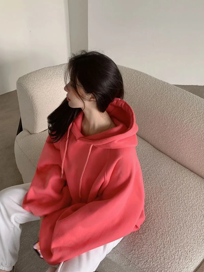 Watermelon red mulberry silk women's hooded sweater in loose pullover style.