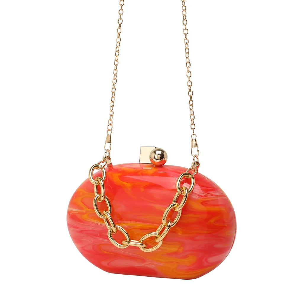 Hard acrylic oval clutch bag with chain strap in a pearlescent colour with phone and file compartments visible.