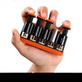 Grey and orange silicone finger trainer for musician hand muscle development