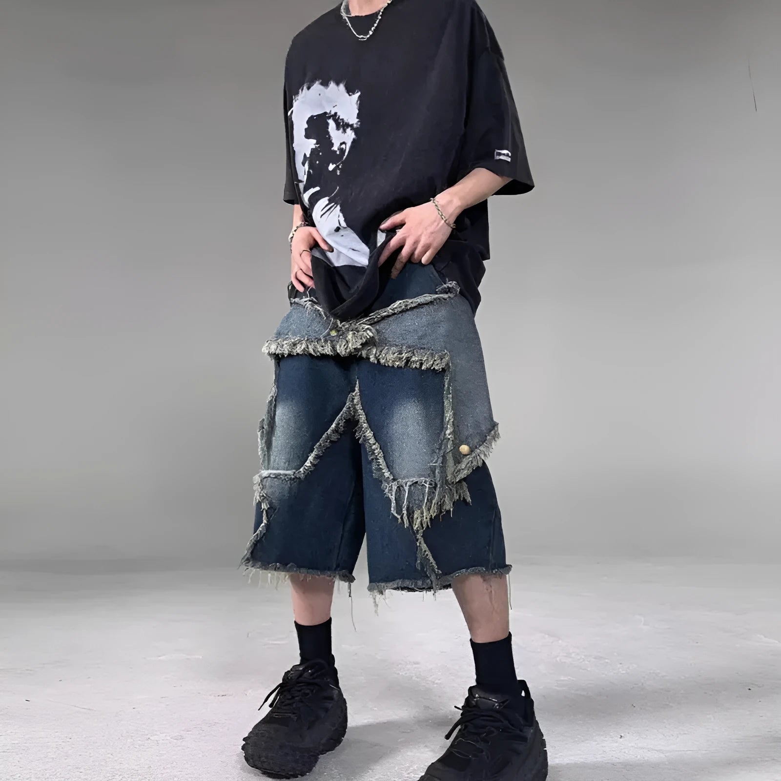 Blue denim shorts with frayed five-pointed star design detail, loose fit cut for summer casual wear