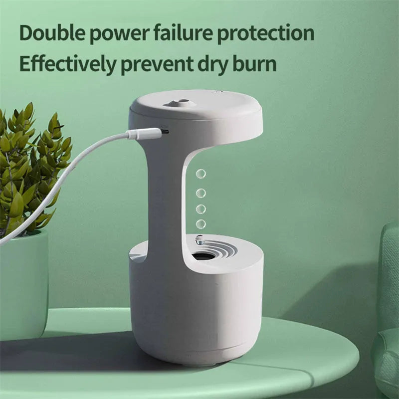 White columnar anti-gravity humidifier with LED clock display and mist output on a wooden desk.