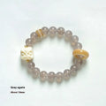 Hand-woven grey agate bracelet with ivory and mellite beads in a millet grain pattern