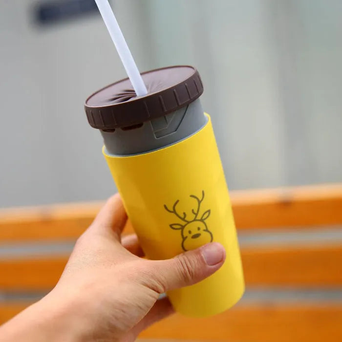 Double wall insulated travel tumbler with twist seal showing cartoon patterns and straw
