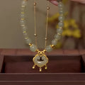 Women's green safety lock bell pendant bracelet with Xiangyun lock design on wrist