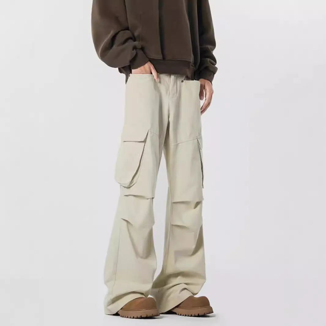 Man wearing retro style high-waisted straight leg casual trousers in black.