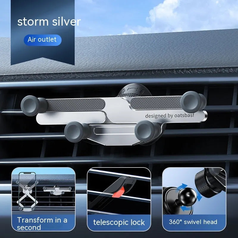 Silver aluminium alloy car phone holder with snap-on bracket mounted on a car air vent