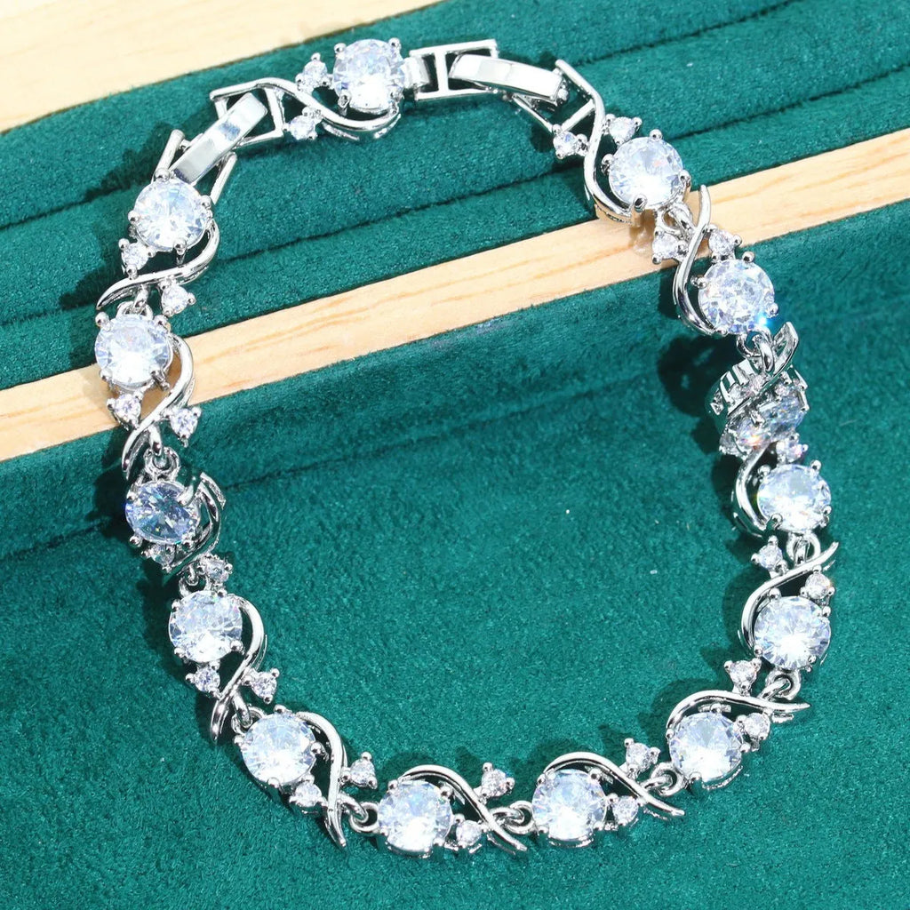 Bridal zircon necklace, bracelet, earrings, and ring four-piece jewellery set in alloy.