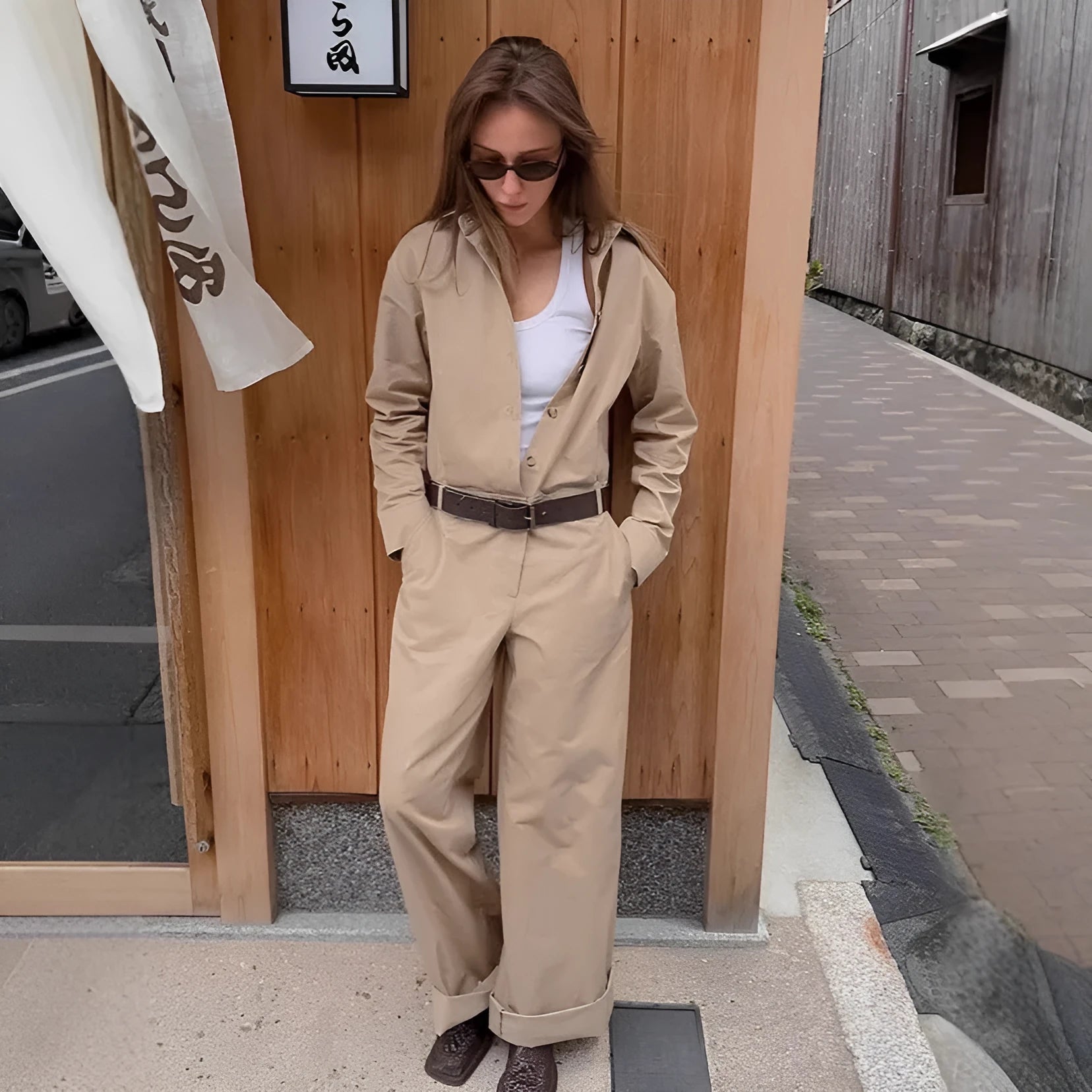 Khaki cargo overalls with drop-shoulder sleeves and mid-waist trouser cut front view