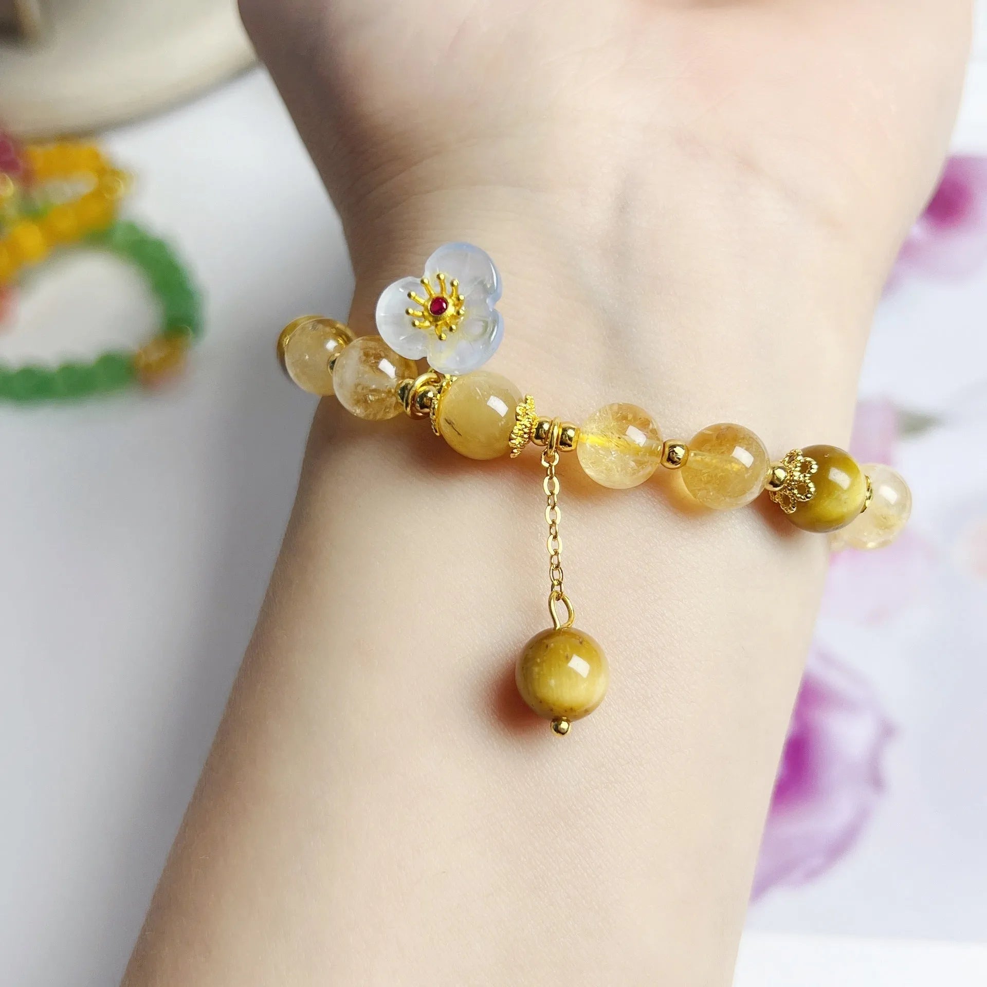 Women's citrine bracelet with floral tassel design, handcrafted crystal jewellery
