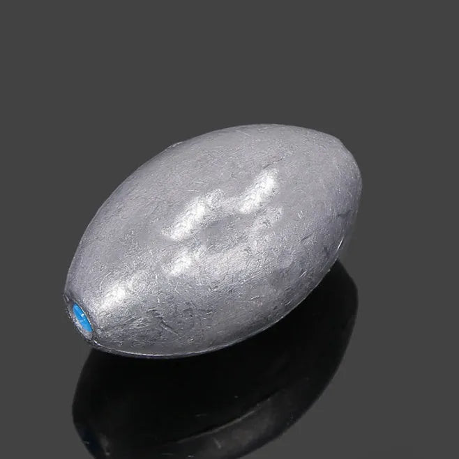 Scaled olive lead fishing sinker with Tongxin plastic core in rugby shape.
