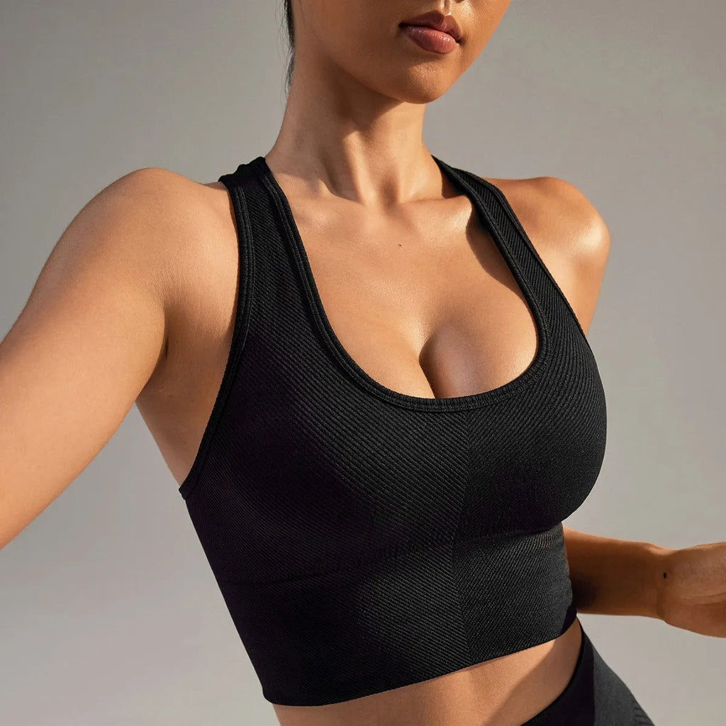 Black women's sports bra with moulded cups and double-shoulder straps for running and yoga