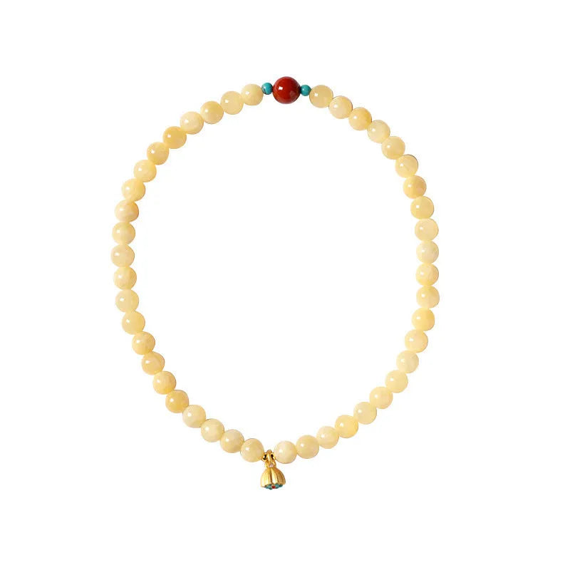 Handmade yellow jade topaz double ring bracelet with lotus seedpod design on 6mm or 8mm beads.