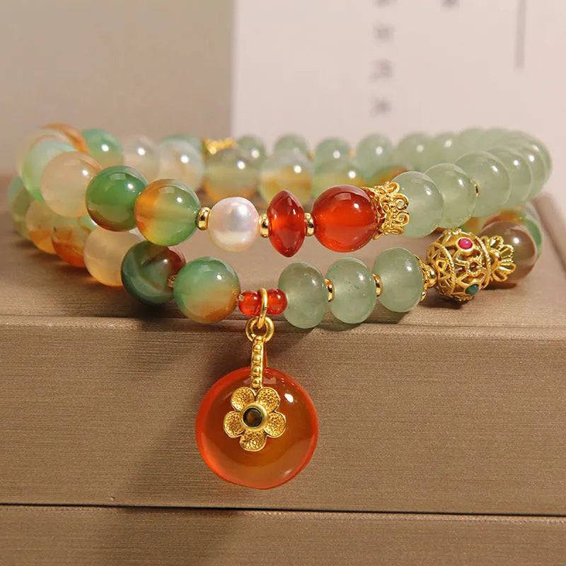 Women's peacock green agate double ring bracelet with safety buckle closure and rhinestone accents
