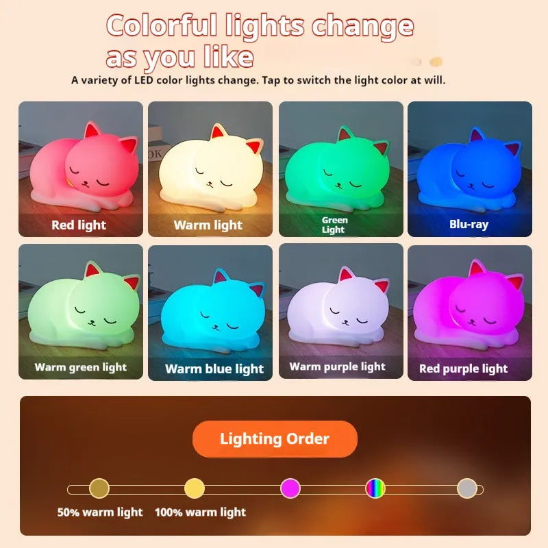 Sleepy cat shaped silicone induction night light with white glow on table