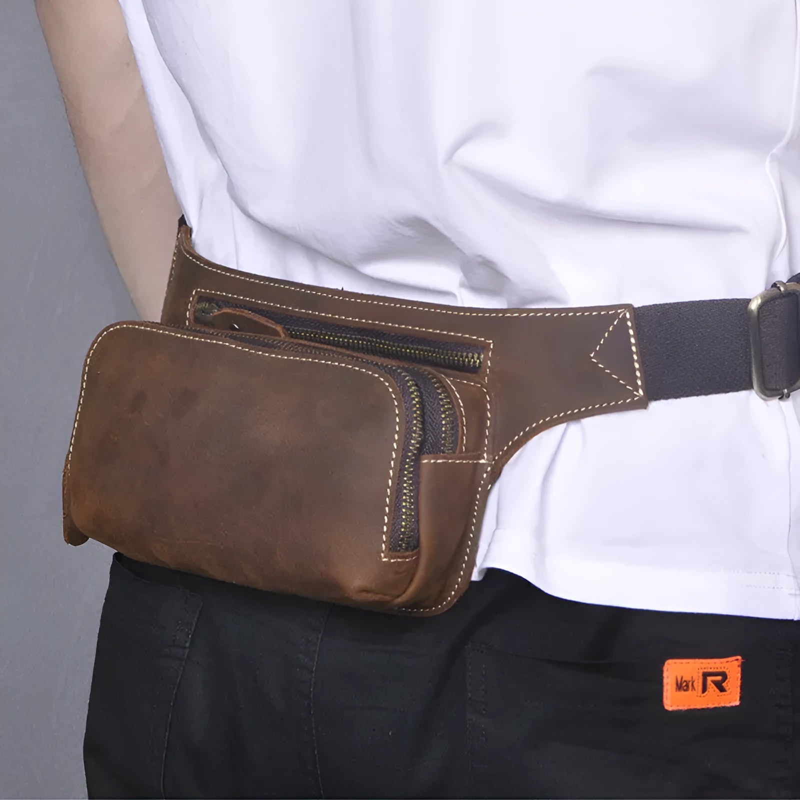 Brown men's sports waist bag made from top layer cowhide leather with pull closure
