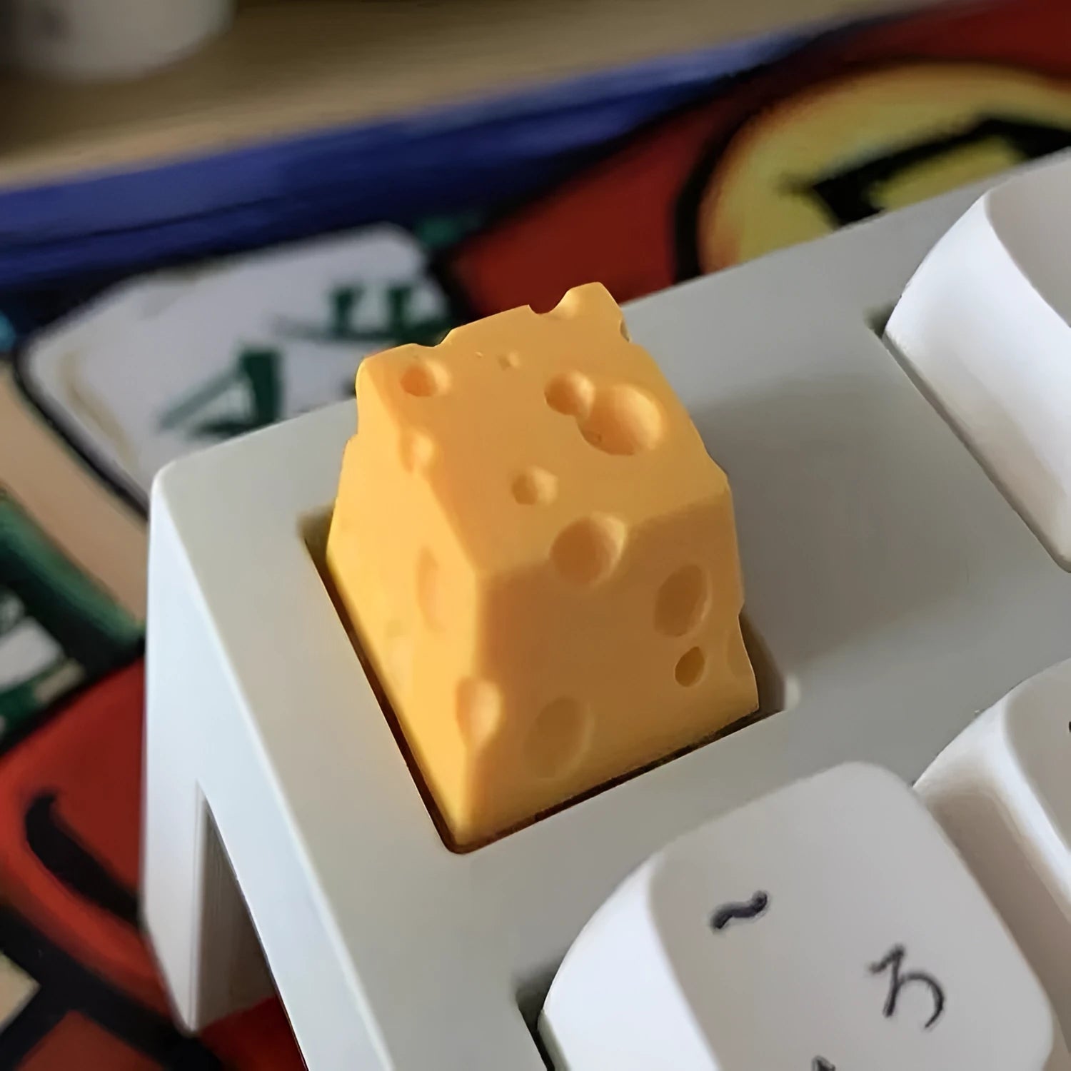 Yellow solid resin artisan key cap sculpted like a piece of cheese for mechanical keyboards.