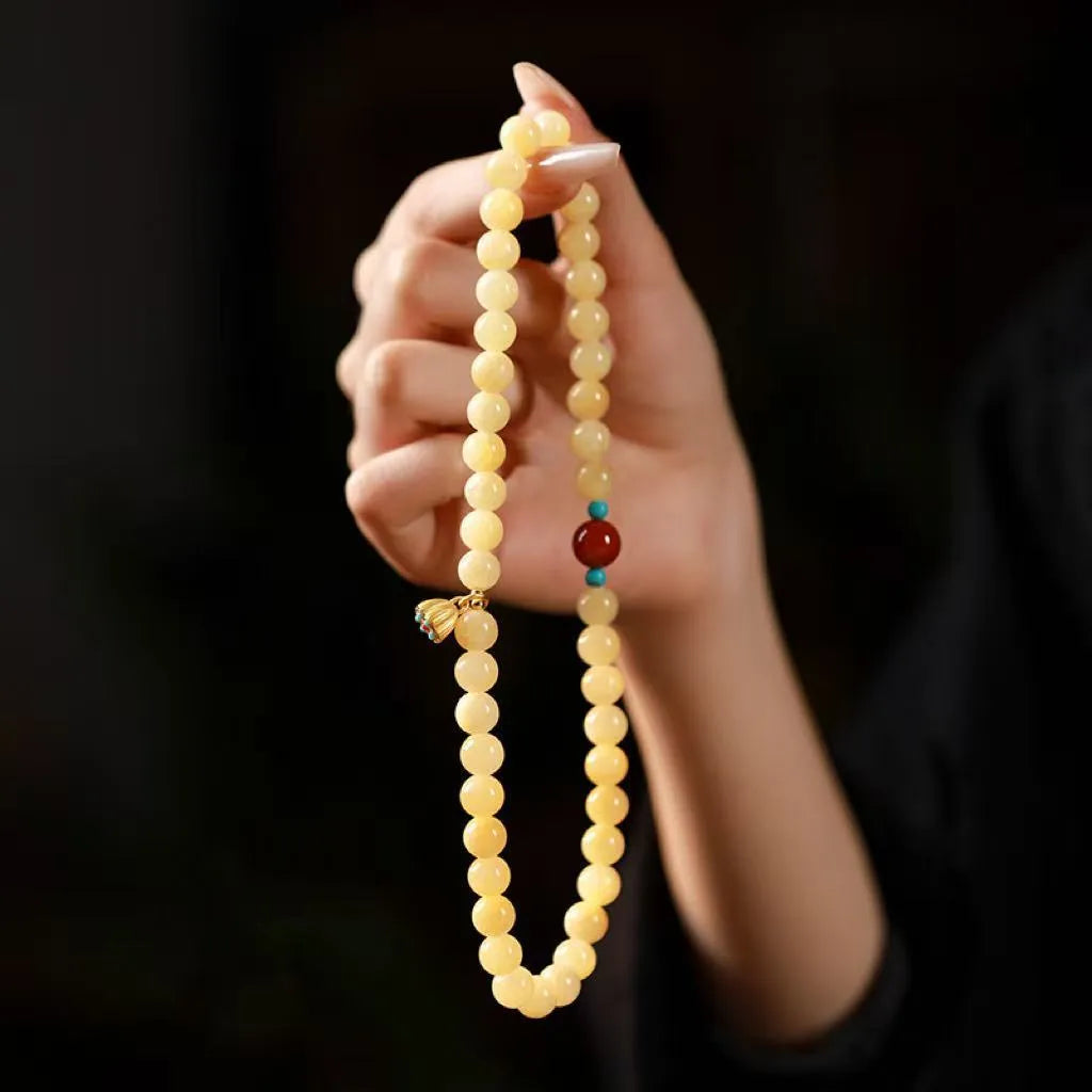 Handmade yellow jade topaz double ring bracelet with lotus seedpod design on 6mm or 8mm beads.