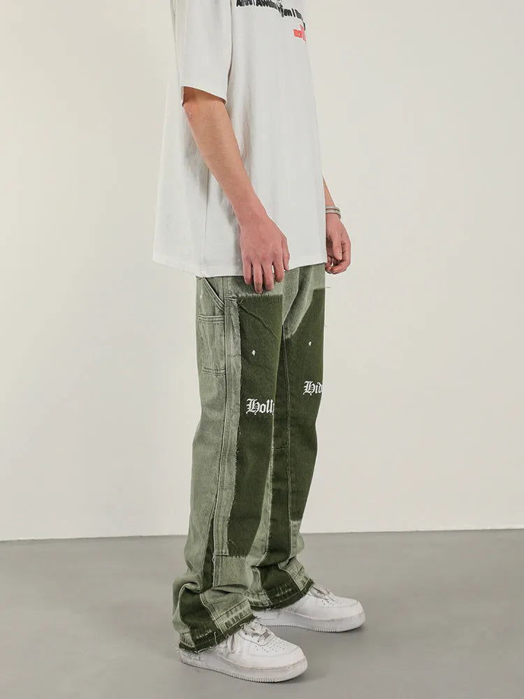 Men's heavy wash flared denim trousers in black green with multi-pocket and raw edge detailing