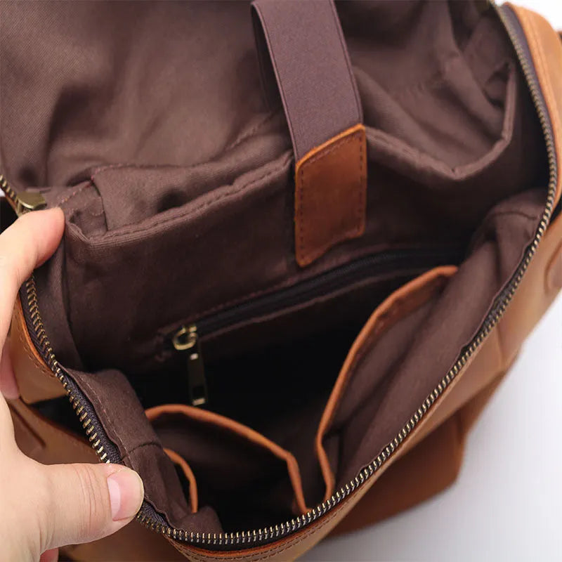 Classic retro backpack in brown Crazy Horse leather with exposed stitching and metal buckles