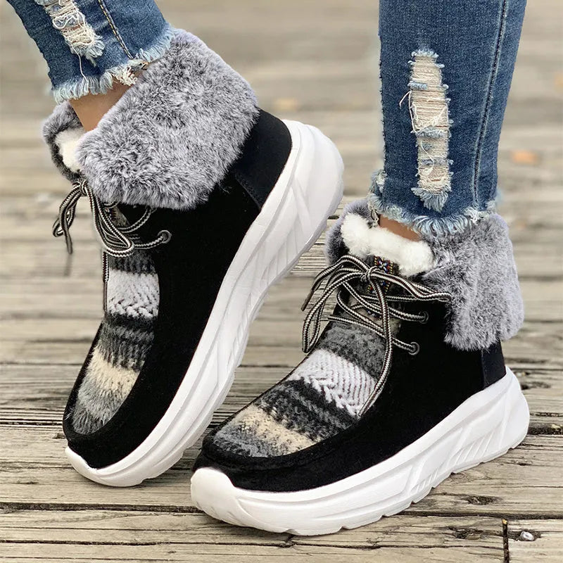 Women's beige lace-up suede snow boots with fuzzy lining and a thick non-slip rubber sole.