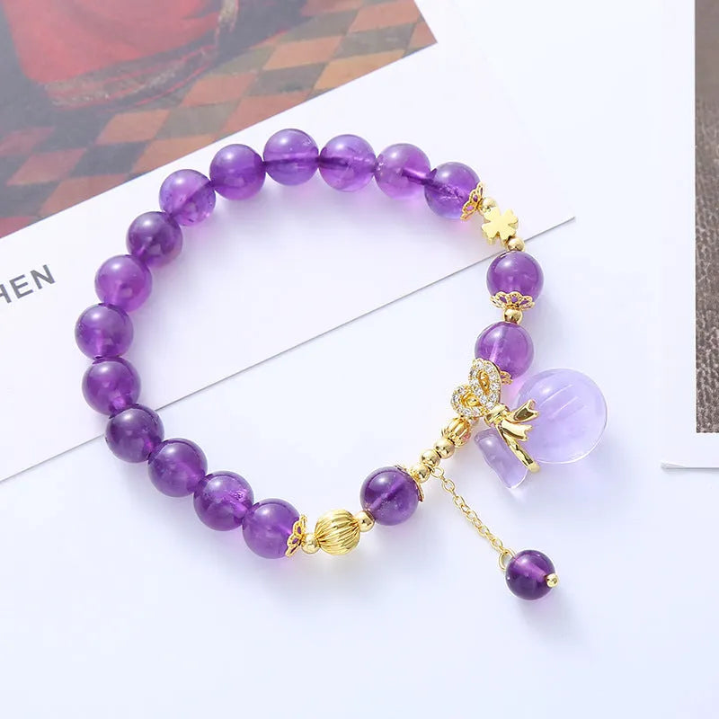 Purple amethyst crystal bracelet with ethnic money bag pendant and peace buckle closure