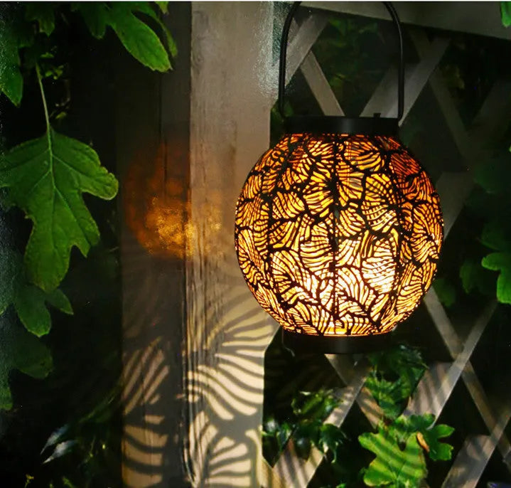 Solar powered outdoor courtyard lamp with decorative iron hollow design and integrated solar panel