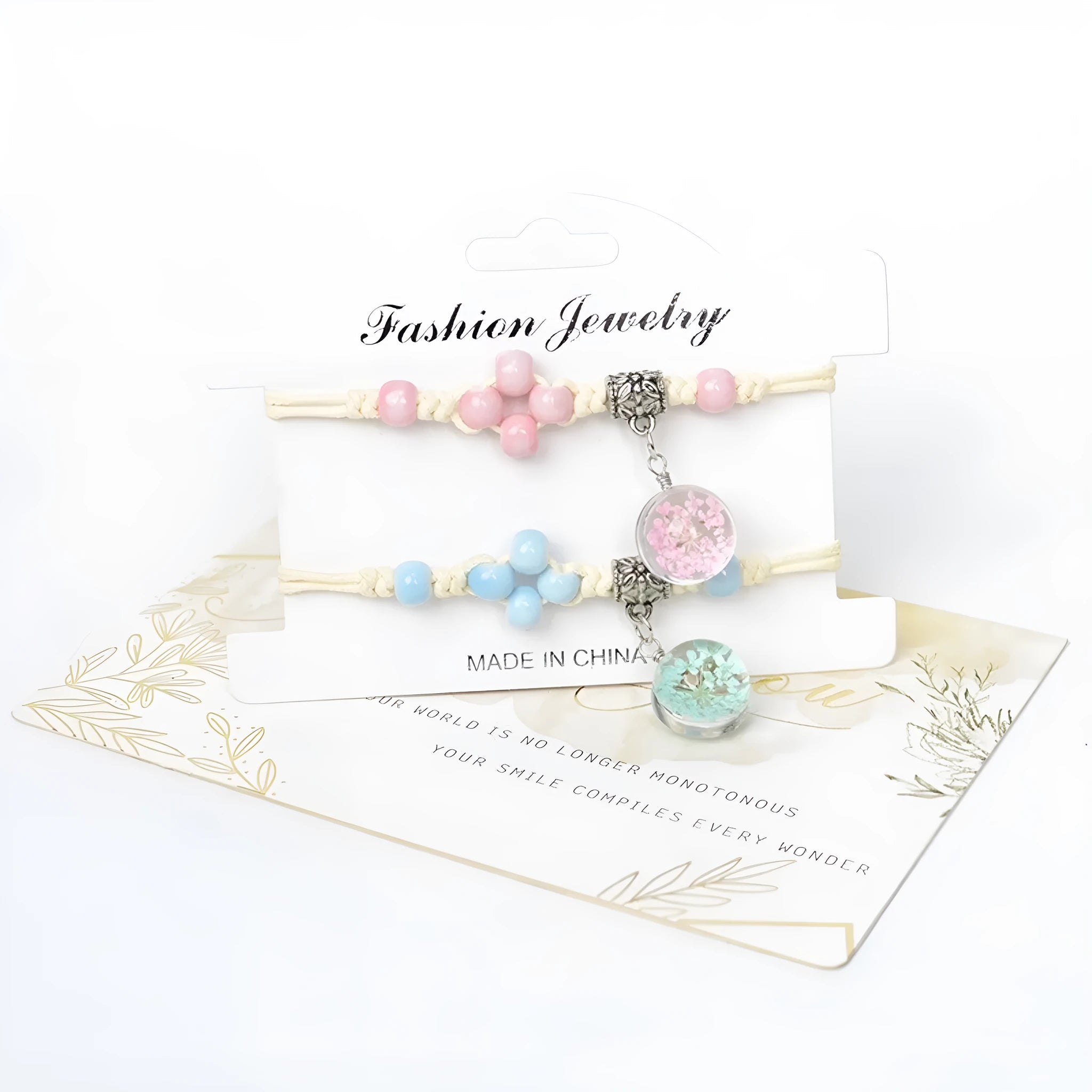 Close-up of a hand-woven glass bracelet with large 1.4cm beads containing real dried flowers and lace floral detailing.