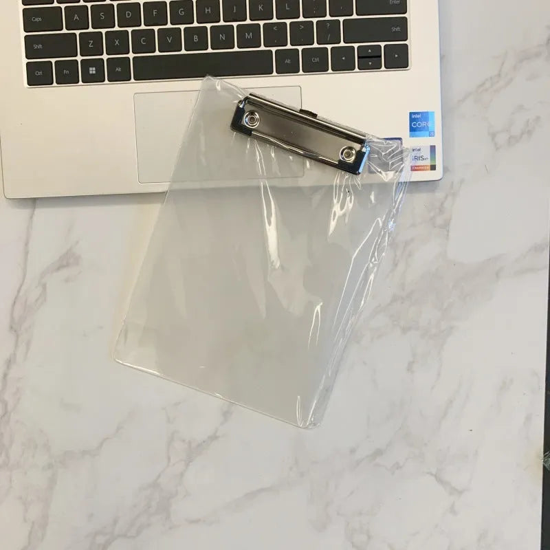 Transparent A4 writing board pad with metal clip holding paper, shown in blue colour option