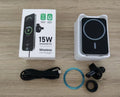 Magnetic car wireless charger holder clipped to a car vent, black X-16 finish, holding a smartphone for hands-free charging and driving.