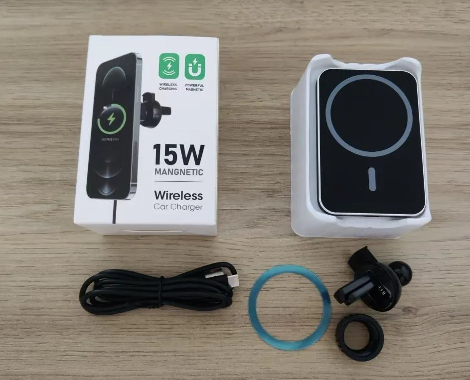 Magnetic car wireless charger holder clipped to a car vent, black X-16 finish, holding a smartphone for hands-free charging and driving.