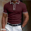 Man wearing a loose-fitting striped short-sleeved T-shirt in a casual setting.