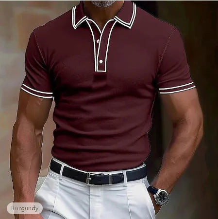 Man wearing a loose-fitting striped short-sleeved T-shirt in a casual setting.