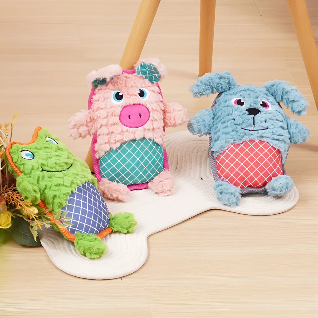 Blue, green, and pink dog toys with sound features and bite-resistant construction safe for molar teeth.