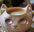Pastel coloured geode style resin mug with a cat design, shown in purple.