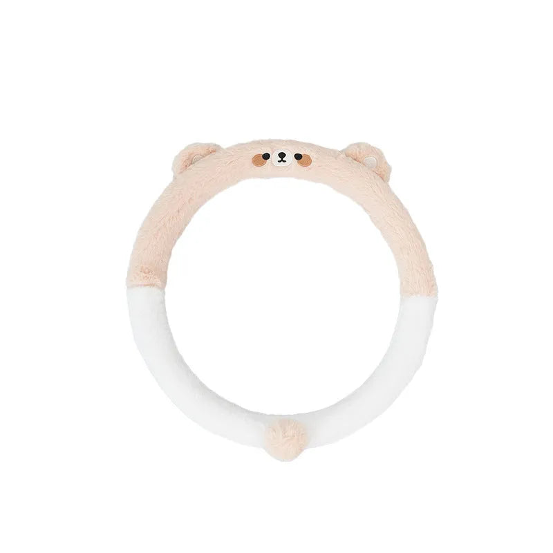 Plush cartoon animal steering wheel cover with embroidery, shown fitted on a car wheel.