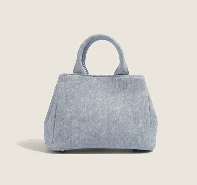 Women's casual denim shoulder handbag in soft PU material with standard sizing and polyester lining