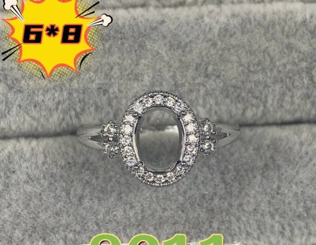 Oval denier open mouth ring with 6x8 main stone and five-pointed star design