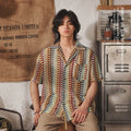 Grey short sleeve Cuban collar shirt with jacquard pattern, shown on a model.